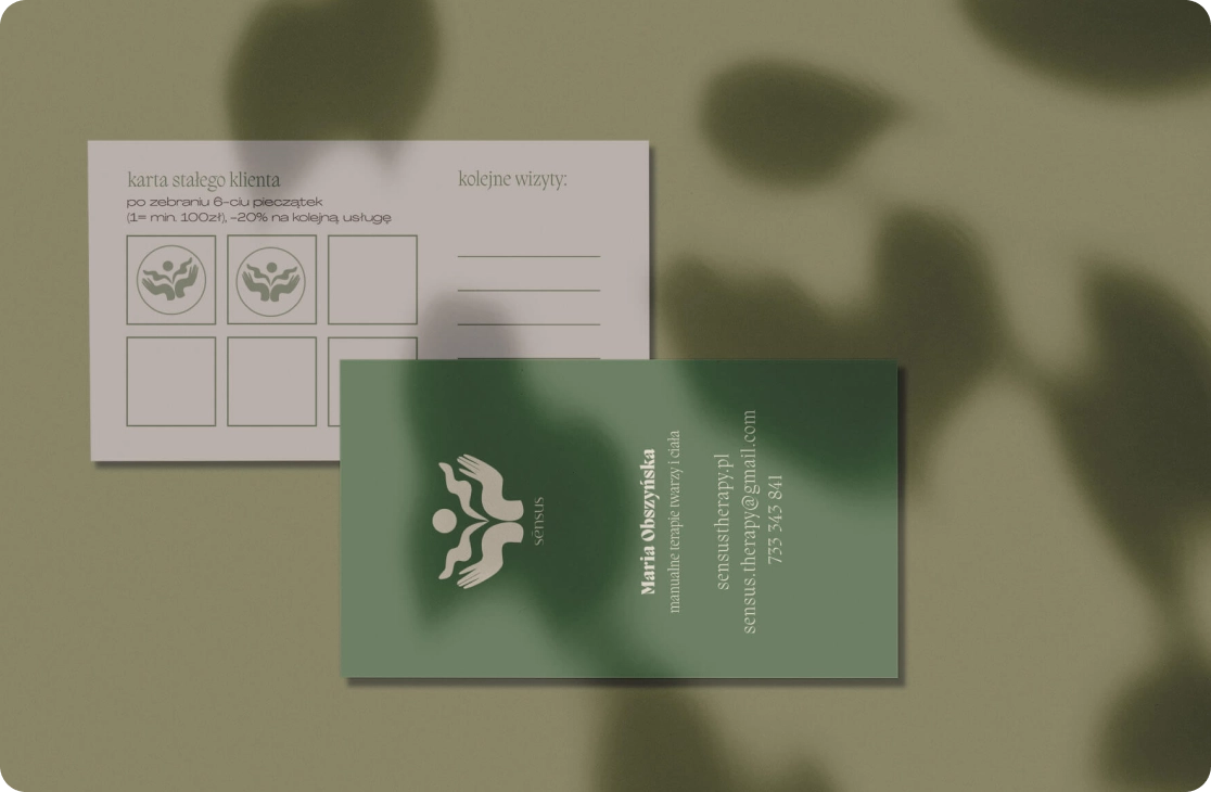 a sage green business card doubling as a loyal customer card, two cards, one on top of another, with a shadow of a plant on them