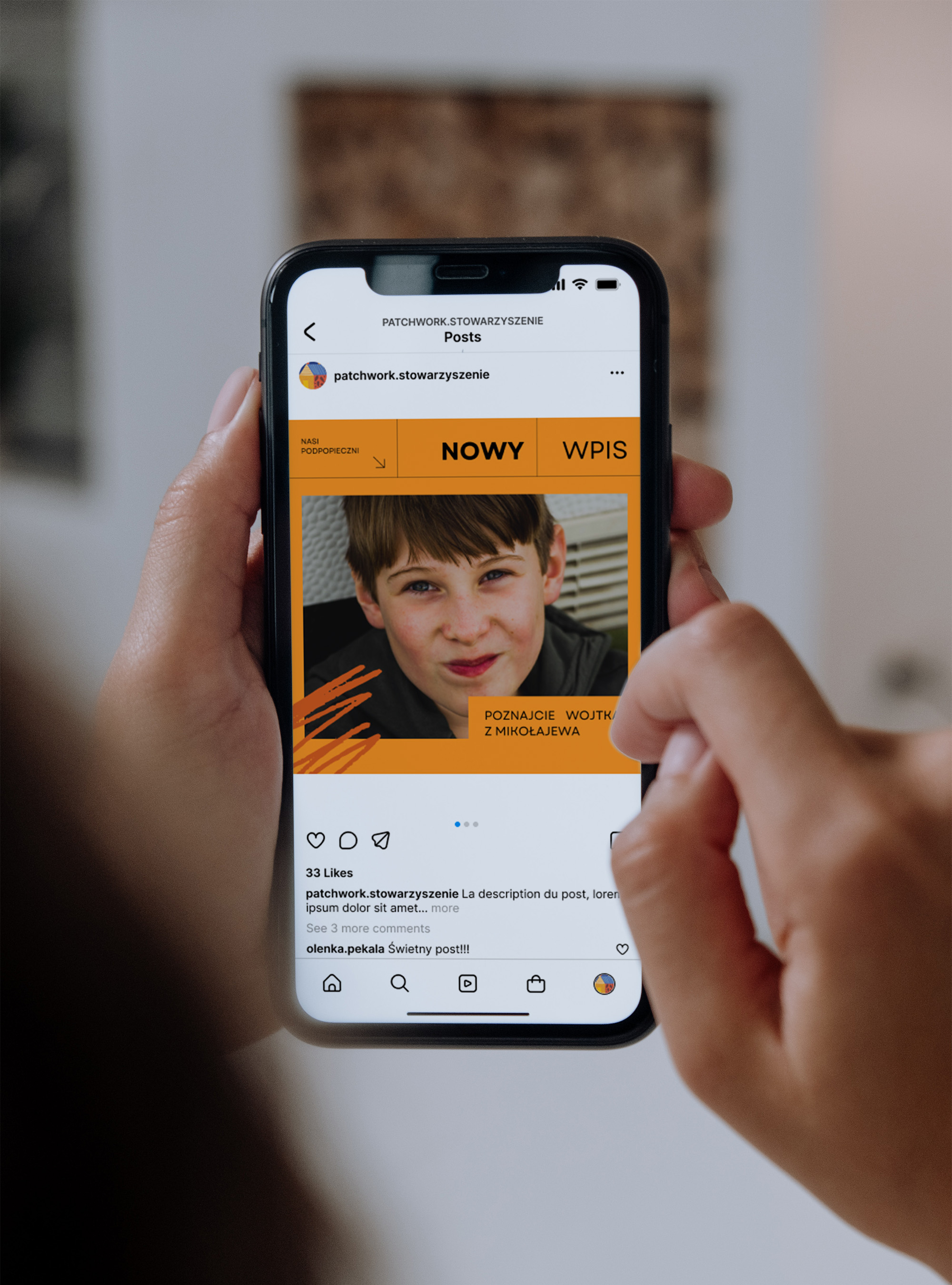 two colorful business cards for Patchwork organisation laid out on a blue fabric