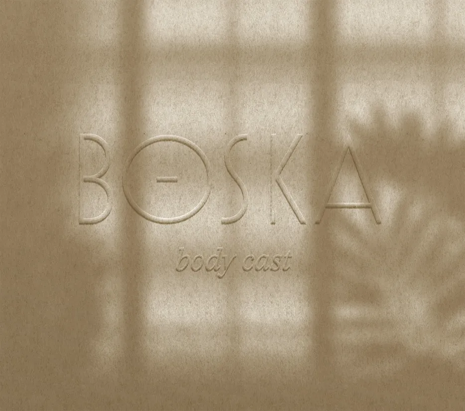 BOSKA logotype blind-embossed on a paper-like beige texture