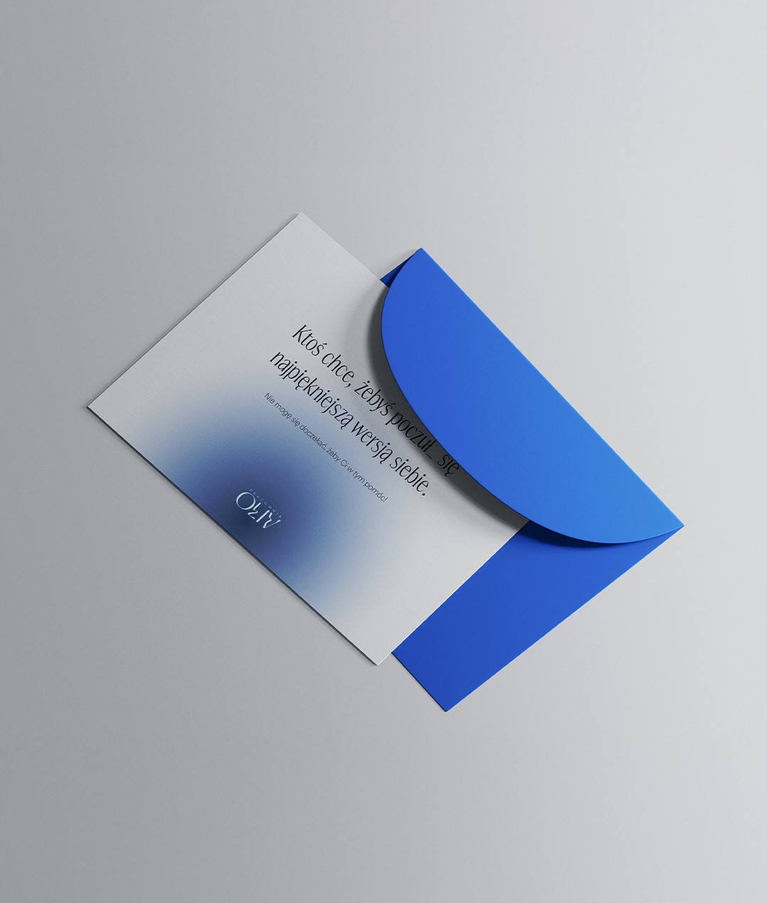 an elegant gift voucher laying on a cobalt blue envelope
